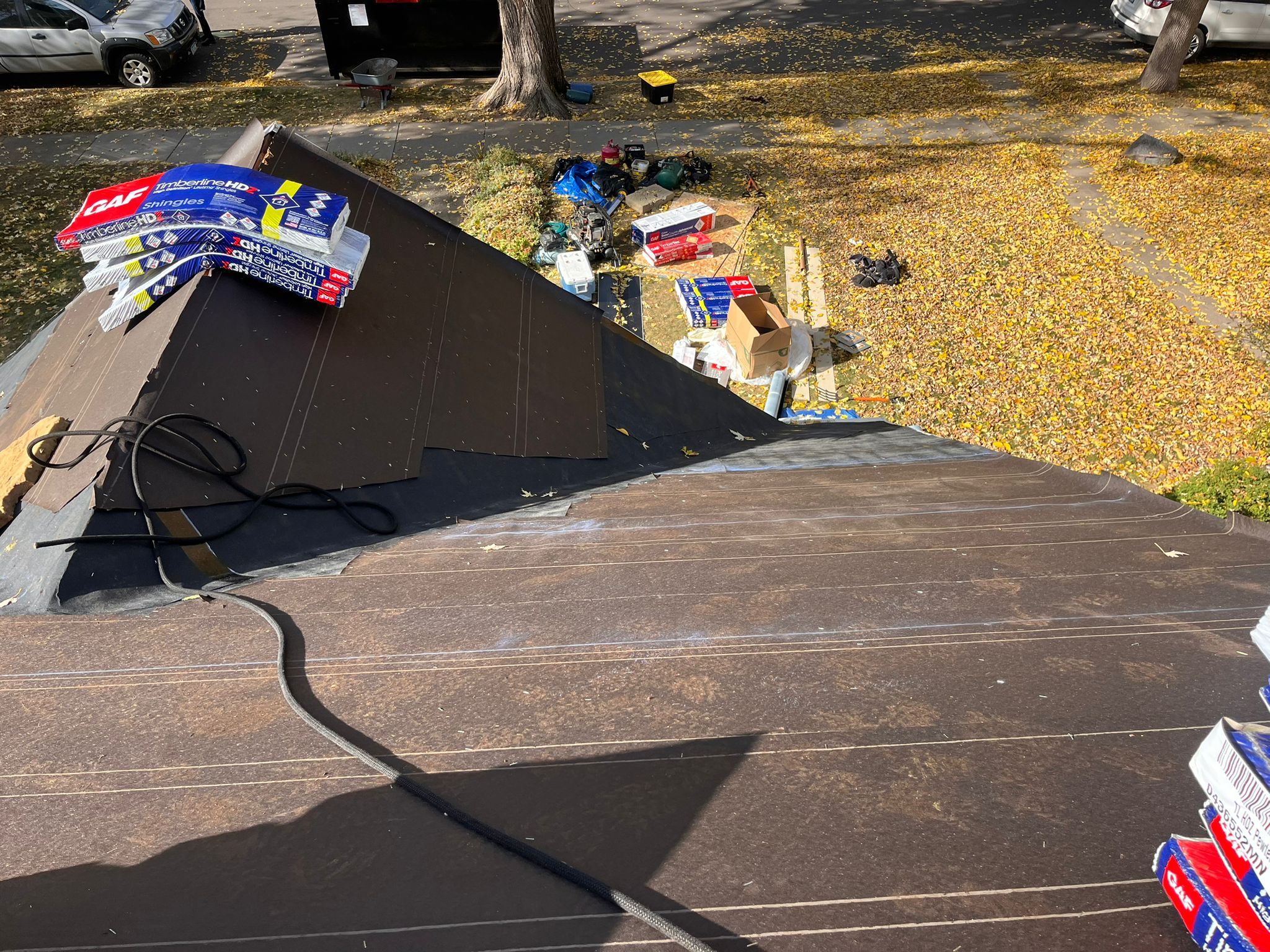 Professional roofing crew performing storm damage roof repairs on a Minnesota home, replacing damaged roofing materials and restoring protection after severe weather.